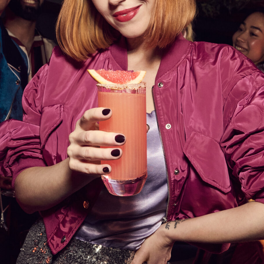 Girl holding Paloma cocktail